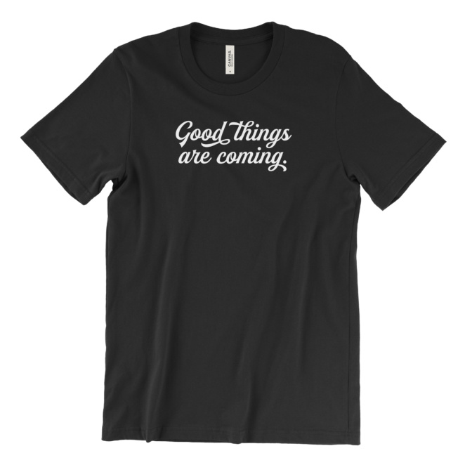 Good things are coming fancy white script on black tee