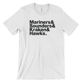 White tee that says Mariners & Sounders & Kraken & Hawks.