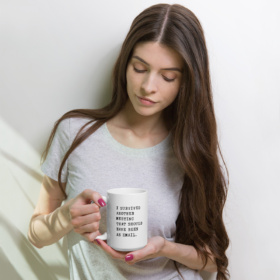 Woman holding white mug that says I SURVIVED ANOTHER MEETING THAT SHOULD HAVE BEEN AN EMAIL. 15oz