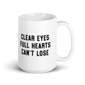 White mug that says CLEAR EYES FULL HEARTS CAN'T LOSE 15oz handle on right