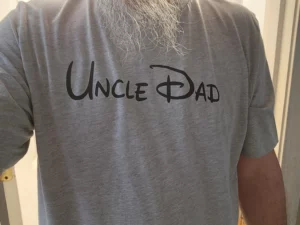 Happy WRDMRK customer wearing custom disney font t-shirt